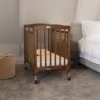 Baby crib mahogany Limea hotel room